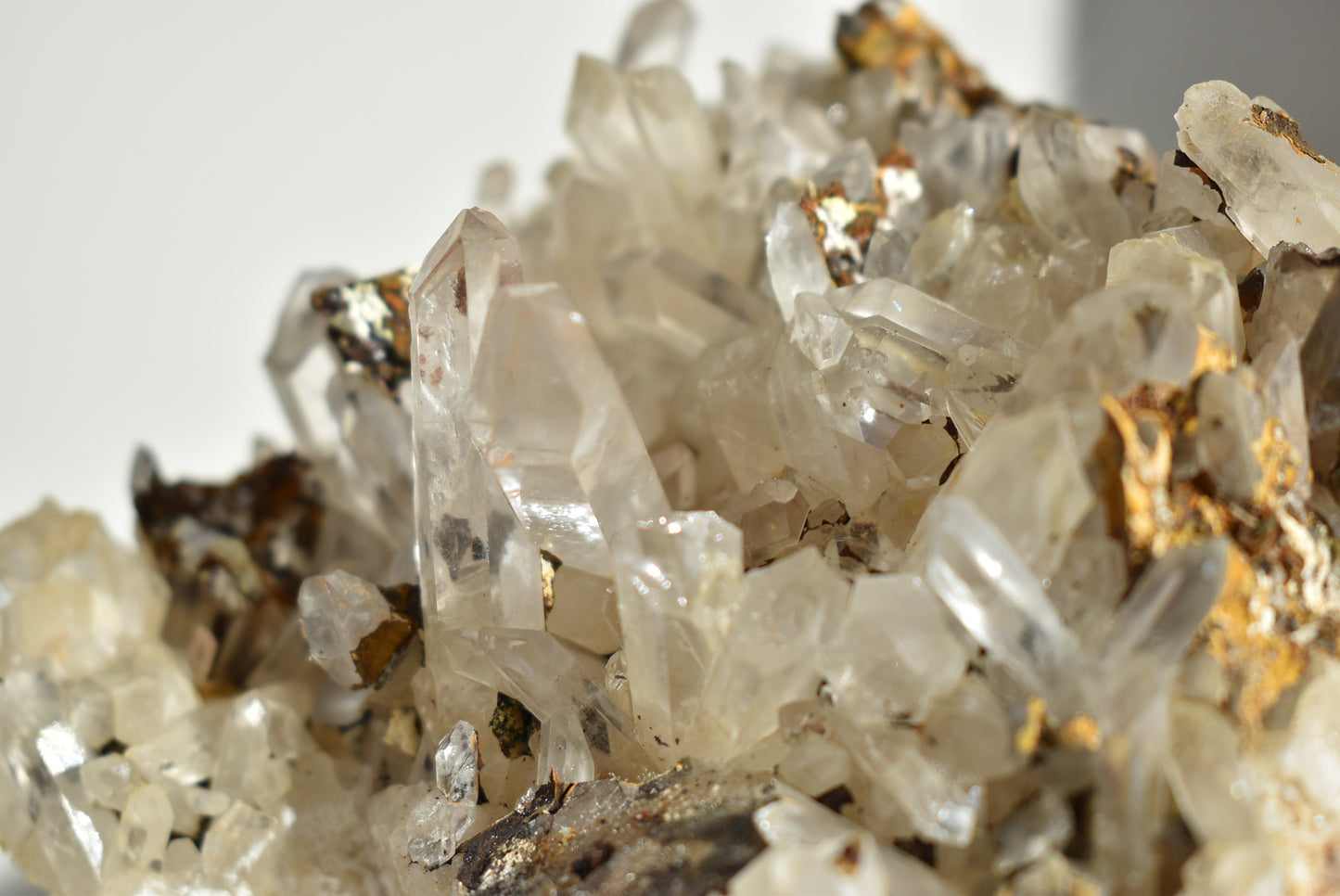 Clear quartz cluster with iron Oxide