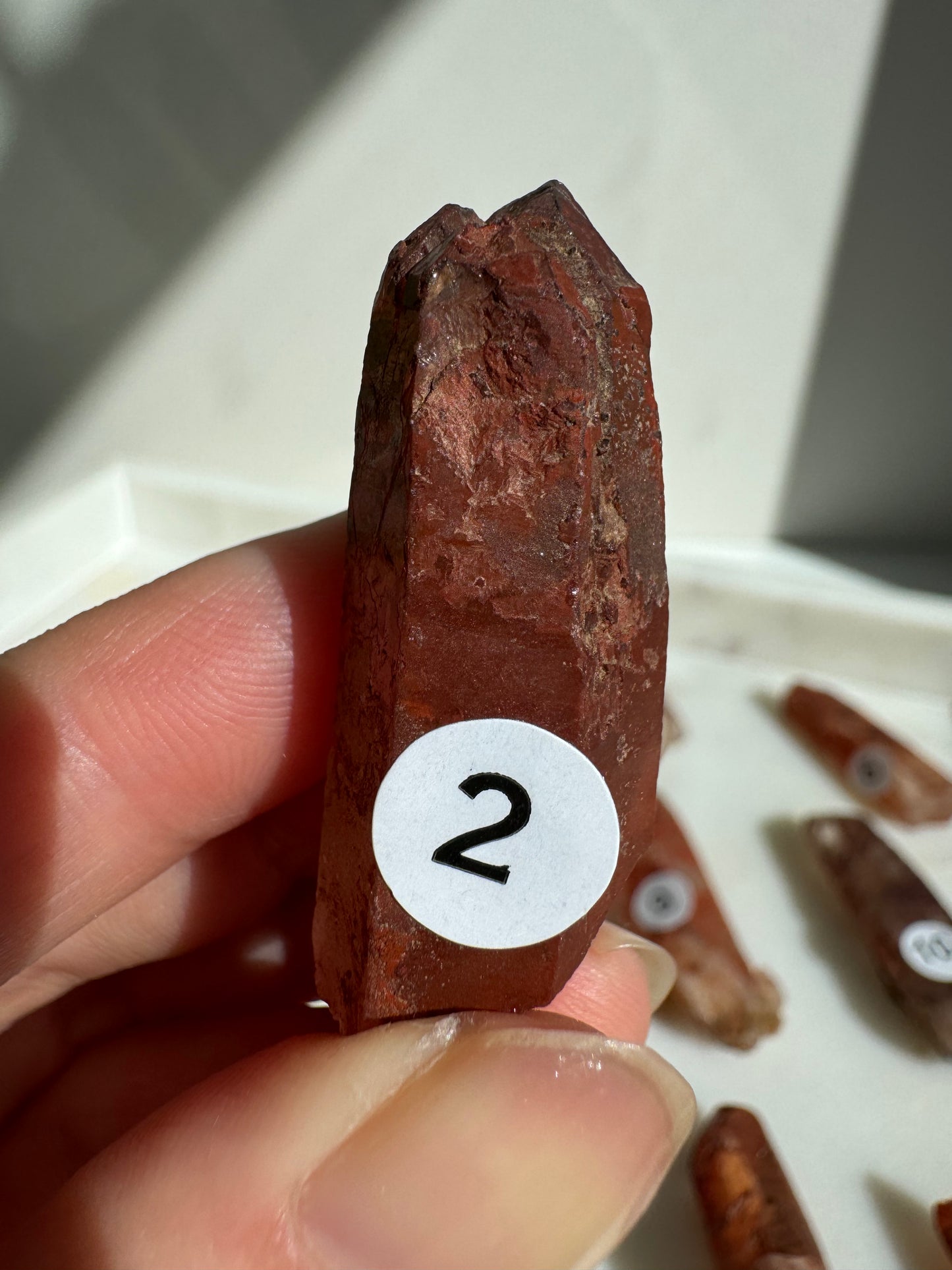 Tibetan Quartz Raw point ( Red Exterior)